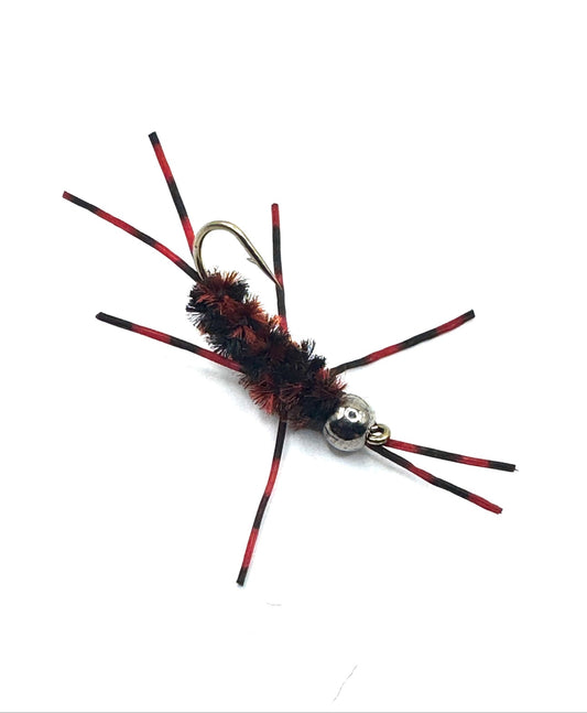 Red and black stonefly fishing lure with barbed hook, fuzzy body, metallic eyes