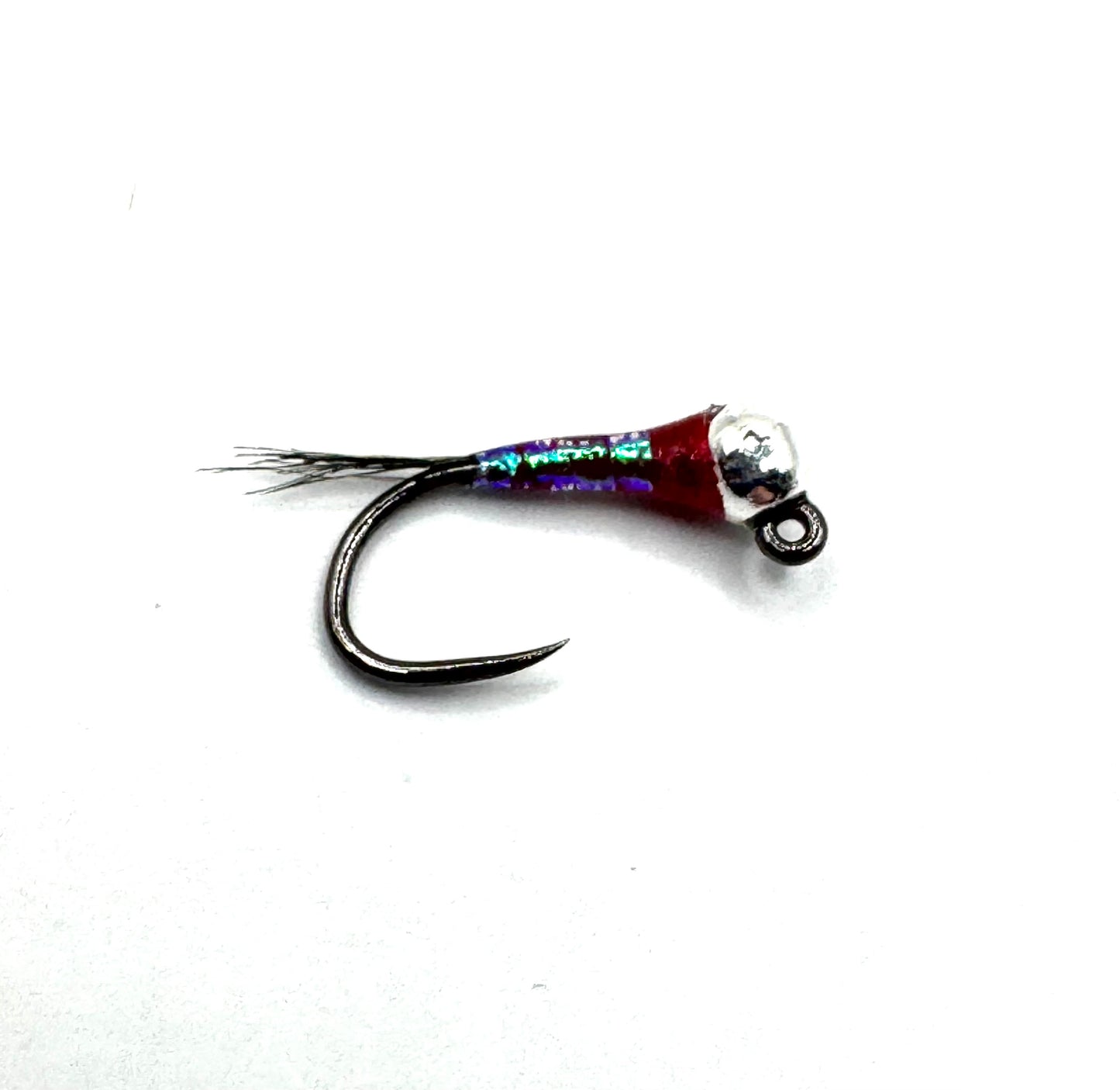 Rainbow Warriors jig with purple-green iridescent body, silver cone head and black hook