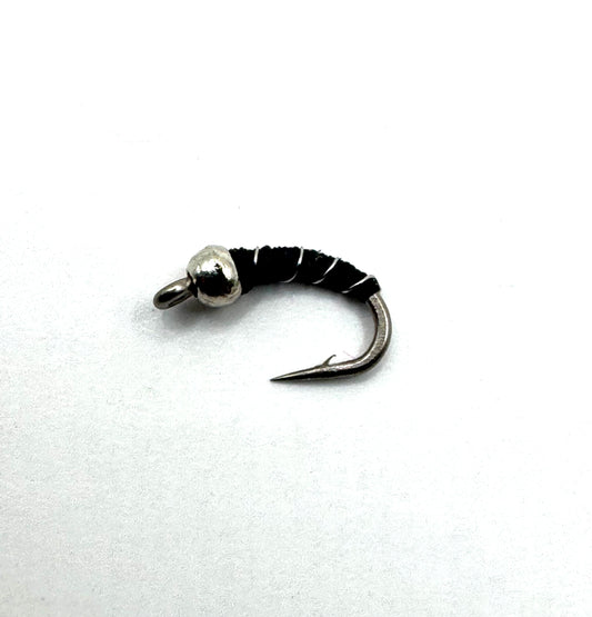 Black zebra midge fly with bead head on a curved hook