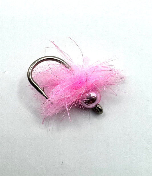 Pink fuzzy fly fishing jig with two dark bead eyes on a black hook