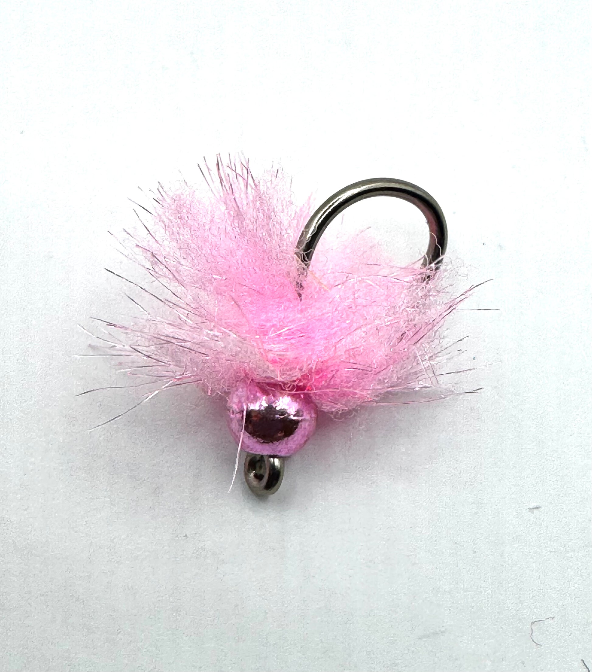 Pink feathered tungsten egg fishing lure with metal eye and hook