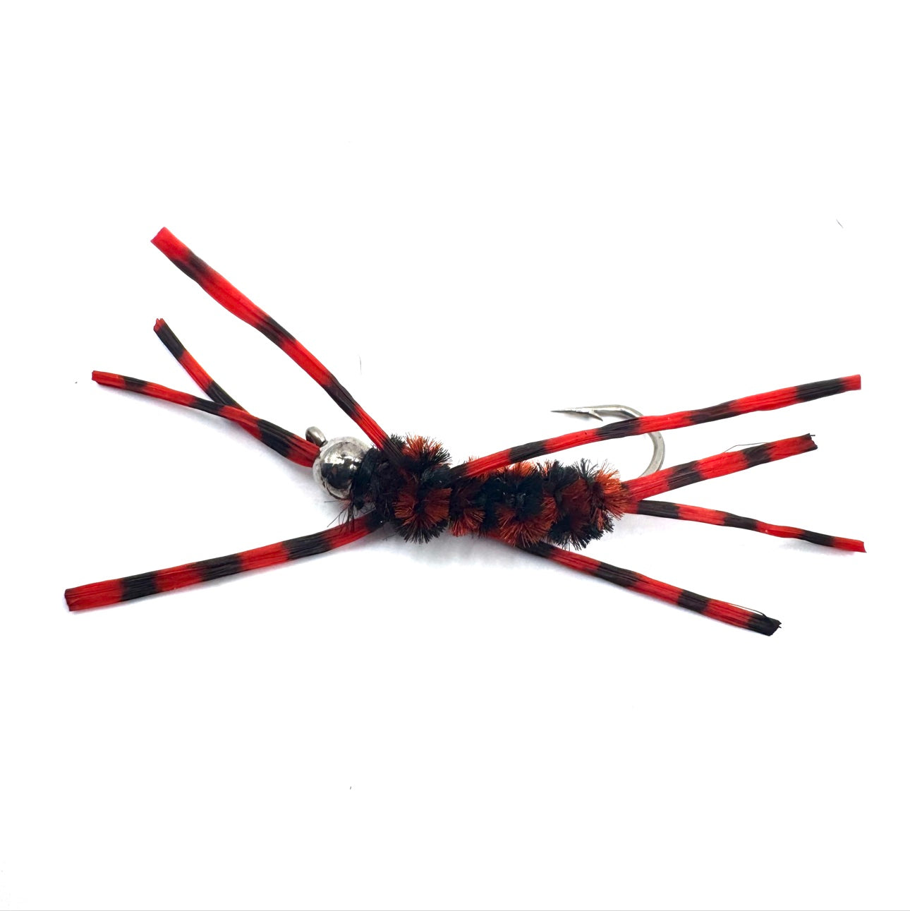 Red-and-black striped fly lure with fuzzy black body and silver hook rings