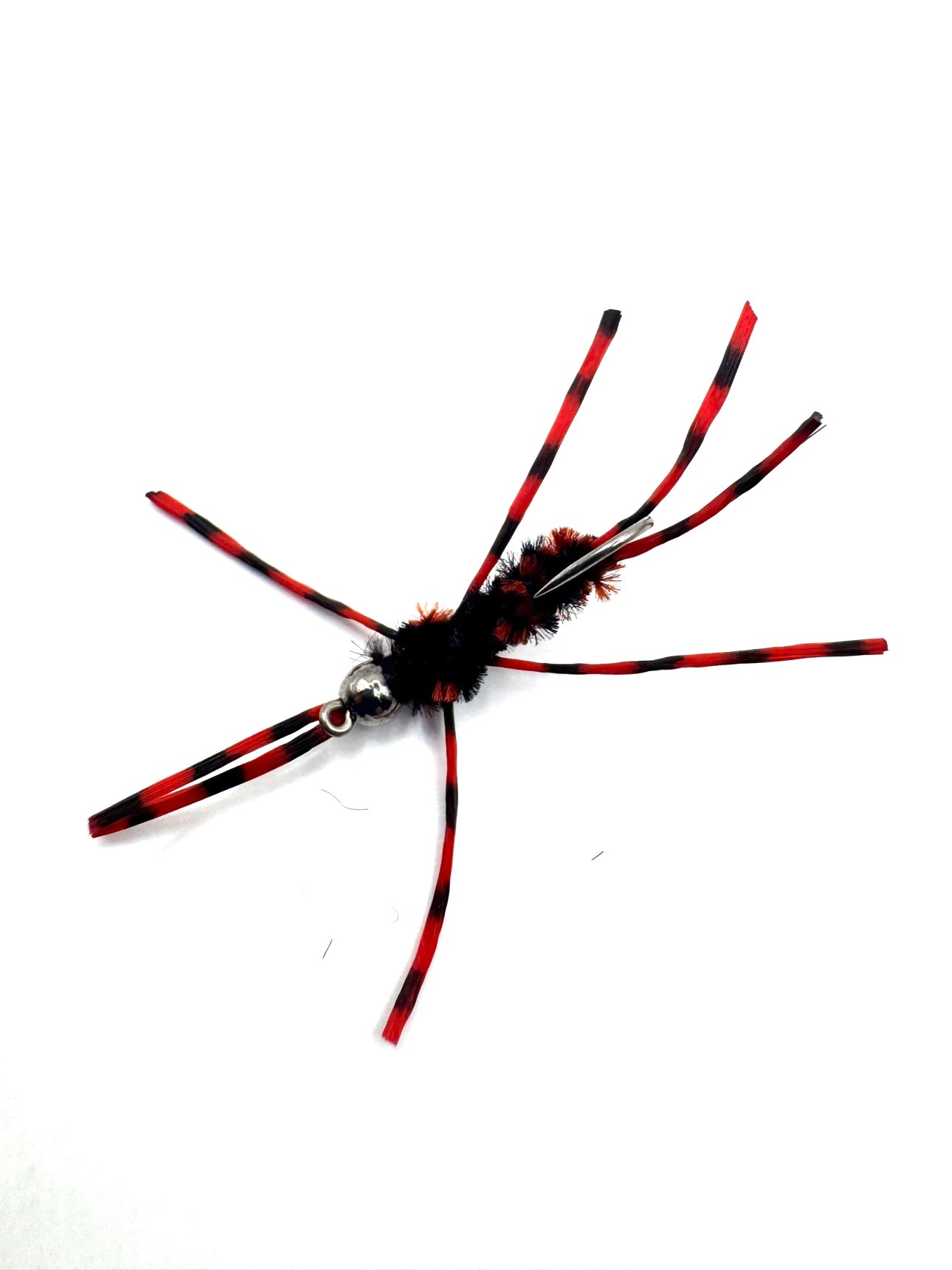 Red-and-black striped fly lure with fuzzy black body and curved silver hook
