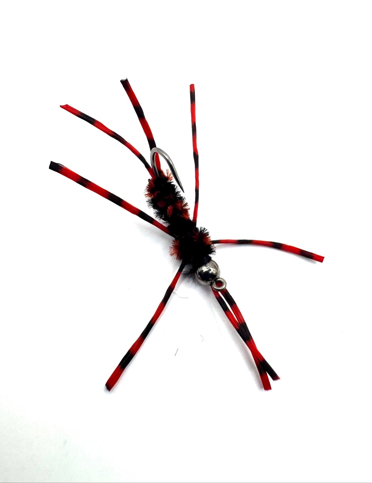 Red-and-black striped fly lure with fuzzy black body and two silver hook loops